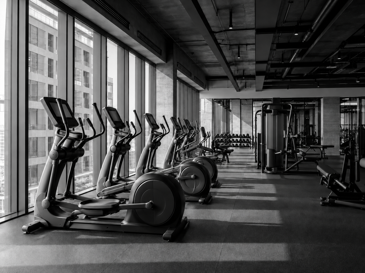 Modern commercial fitness facility with cardio and strength equipment